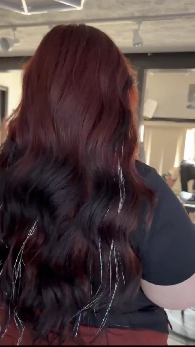 Long dark red wavy hair with silver tinsel strands