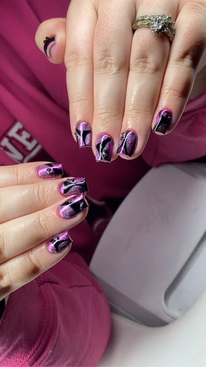 Purple and black cat-eye nail art